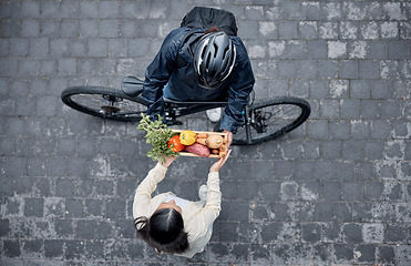 Image showing Grocery customer, courier delivery and biker with retail sales product, shopping nutritionist or food shipping container. Logistics supply chain, top view and cycling distribution person with bicycle