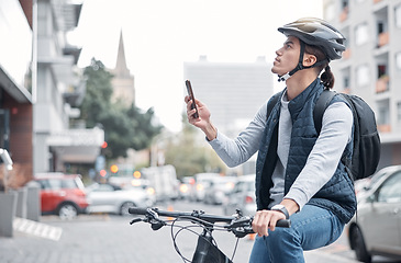 Image showing Travel, bike delivery or man with phone in London city, street or road for GPS, location or networking outdoor. Internet, search or male with smartphone for mobile app communication or 5g network