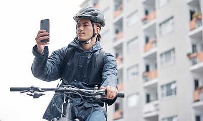 Image showing Travel, bike delivery or man with phone in London city, street or road for GPS, location or networking outdoor. Planning, driver or male with 5g smartphone or communication, search or social network