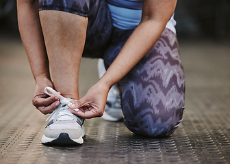 Image showing Hands, tie shoes and fitness in gym to start workout, training or exercise for wellness. Sports, athlete and woman tying sneakers or footwear laces to get ready for exercising or running for health.