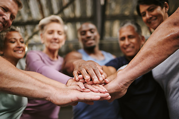 Image showing Teamwork, hands together and senior people in gym for motivation, solidarity and team building. Collaboration, group of friends or retired men and women huddle for workout goals and training targets