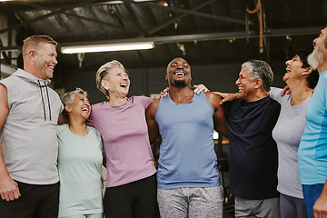 Image showing Senior workout group, laugh and personal trainer, smile or support for wellness goal. Elderly women, team building and happy at gym for friends, solidarity and diversity for teamwork motivation hug