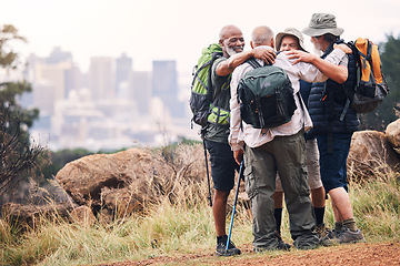 Image showing Hiking, city and hug with old men on mountain for fitness, trekking and backpacking adventure with mockup. Support, motivation and expedition with friends on trail for health, retirement and journey