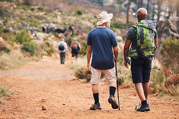 Image showing Hiking, fitness and people walking on mountain for adventure, freedom and wellness in outdoor forest. Travel, retirement health and senior hikers for exercise, trekking and cardio workout in nature