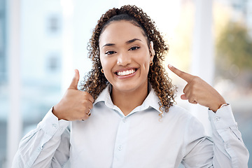 Image showing Woman, portrait and thumbs up for hearing aid, auditory treatment or audiologist at health clinic. Happy female with smile showing hand gesture or thumb emoji for listening success, trust or thanks