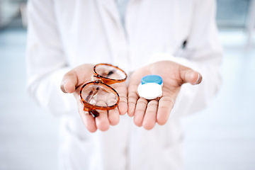 Image showing Eye care, choice with glasses or contact lens in hands, closeup and vision with healthcare for eyes. Prescription lenses, person with frame and plastic container, optometry with optician and health