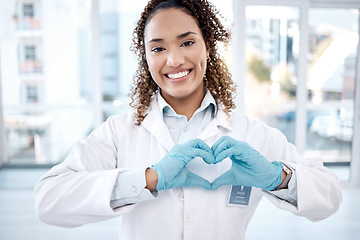 Image showing Woman, love and heart hands portrait in hospital for care, trust and support on valentines. Healthcare, dentist and happy black female doctor with hand gesture for affection, romance and kindness.