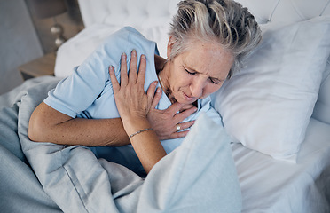 Image showing Heart attack, senior woman and chest pain, anxiety or medical emergency in her bedroom. Heartburn, stress or stoke of elderly person cardiology, breathing and lung problem with healthcare risk