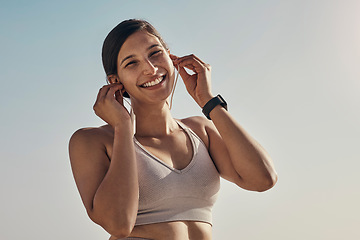 Image showing Fitness, portrait and music for woman at a beach for running, training and cardio on sky background. Happy, face and radio for girl on mockup for exercise, wellness and motivation with podcast track