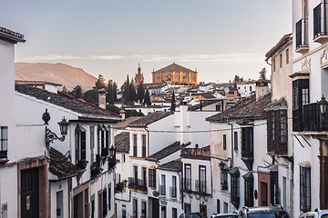 Image showing Views of the medieval village of Ronda with white Andalusian houses and the gothic style church of Santuario de Maria Auxiliadora. Malaga, Spain.