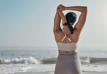 Image showing Back, stretching and woman and a beach for yoga, fitness and cardio on ocean mockup. Rear view, arm and stretch for girl during meditation, exercise and workout at the sea for wellness and peace