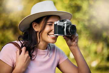 Image showing Photography, smile and woman with a camera in nature during travel in Singapore. Vacation, tourism and professional ecology photographer in a botanical garden to capture the natural environment