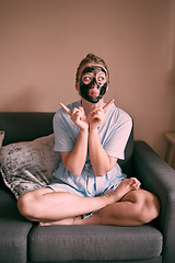 Image showing Self love, face mask and relax goofy woman in her home, house or apartment doing morning beauty routine with hand gesture. Portrait, facial and female funny and excited for skincare using charcoal