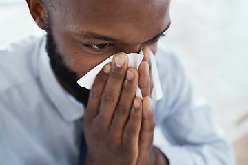 Image showing Black man, tissue and blowing nose in business for allergies, sickness and cold virus. Male employee, sick face and sneeze from flu, allergy and health symptoms of sinus, disease and medical risk