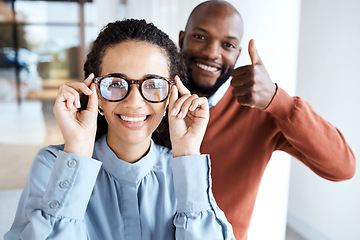 Image showing Glasses, portrait and woman with a thumbs up from an optician for the choice of frame in a store. Yes, agreement and girl with eyeglasses from a black man giving vision service with a hand sign