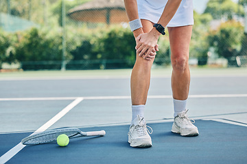 Image showing Tennis court, woman knee injury and training outdoor for fitness, health or wellness by blurred background. Summer, sports and exercise with pain in legs at game, contest or competition in sunshine