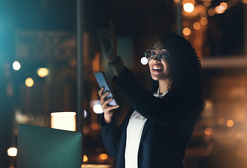 Image showing Business woman, phone and night in the office with bokeh lights to work late for project deadline. African American female employee working overtime with smartphone technology in a dark workplace