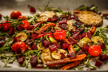Image showing Roasted vegetables with fresh rocket