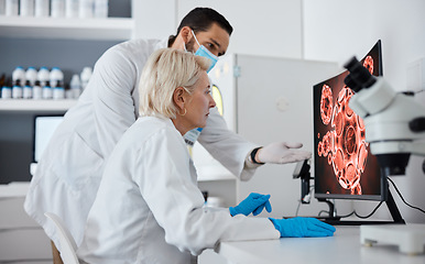 Image showing Computer, covid and science in a medical research laboratory using technology for analytics of a virus on screen. Team, teamwork and technician looking at microscopic image with expert