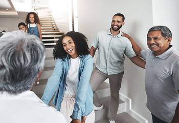 Image showing Black family, welcome and senior parents in home with holding hands, smile and happiness on stairs. African people, children and women on steps together with excited solidarity, support and care