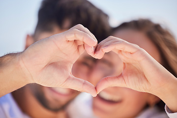 Image showing Heart shape, happy and couple on a date for valentines day, romance or anniversary vacation. Happiness, holiday and young man and woman with a love hand sign or gesture while on a weekend trip.