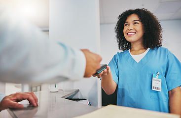 Image showing Card machine, nurse and man with a payment in the hospital for healthcare, medicine or consultation. Finance, medical and male patient paying for pharmaceutical treatment by a female doctor in clinic