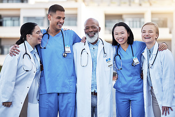 Image showing Healthcare, collaboration and doctors with nurses in medicine standing outdoor at a hospital as a team you can trust. Medical, teamwork or laughing with a man and woman medicine professional group