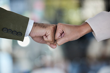 Image showing Hands, fist bump and trust in corporate partnership for unity, agreement or deal against blurred background. Hand of people bumping fists in collaboration for teamwork, goals or support for winning