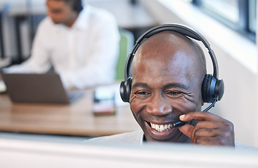 Image showing Crm, call center and black man with a smile from business, contact us and telemarketing call. Office, consulting and web support employee working on an online consultation for digital help and advice