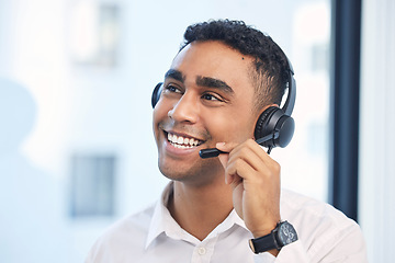Image showing Call center, consulting and smile with man in office for customer support, telemarketing or communication. Sales, advice and happy with employee for help desk, contact us and advertising agent