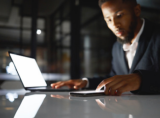 Image showing Laptop screen, phone and black man at night for fintech management, trading and stock market data analysis. Finance, accounting and business person with omnichannel for global investment and mockup