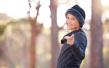 Image showing Fitness, nature and portrait of a woman pointing while walking, training or running in Norway. Motivation, choice and girl in the mountains for exercise, hiking or morning cardio with mockup space