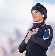 Image showing Hands on chest, health and fitness with woman outdoor, peace and zen with fresh air, run and phone, earpods for music. Calm, nature view and 5g, happy runner or hiking, smartwatch and mockup space