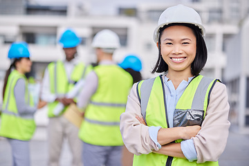 Image showing Portrait, Asian woman arms crossed and engineer outdoor, building and inspector with smile, new project and deadline. Face, female employee and manager with hard hat, vest and construction inspector