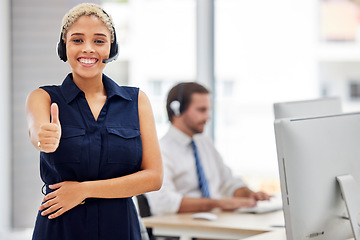 Image showing Success, portrait or happy consultant with thumbs up in call center helping with financial loan advice. Crm, black woman or insurance agent in communication at customer services with like or ok sign