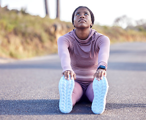 Image showing Fitness, stretching and running with black woman in road for jogging, workout and cardio exercise. Training, health and marathon with runner in street and legs warm up for wellness, sports and goal