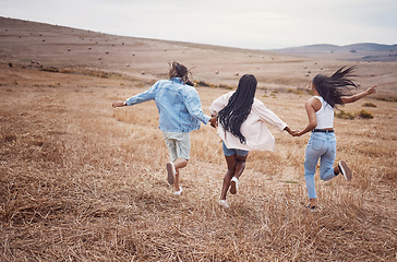 Image showing Freedom, nature and run with woman friends together outdoor for adventure, fun or exploring the wilderness. Running, autumn and excited with a friend group playing outside while bonding from the back