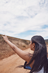 Image showing Travel, road trip and woman with hand out car, having fun and enjoying time outdoors. Adventure, freedom and girl or female on a drive in nature, desert or safari on holiday, vacation or journey.