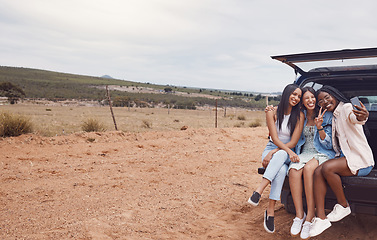 Image showing Peace sign, road trip and women friends take a selfie, having fun or enjoying time outdoors. Car travel, v gesture and group of happy girls in nature or safari taking pictures for social media memory