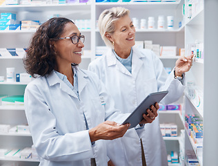 Image showing Tablet, teamwork and pharmacist check stock in pharmacy, drugstore or medication shop. Medicine, technology and medical doctors or happy senior women with touchscreen for checking product inventory.