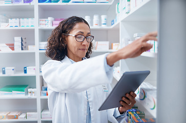 Image showing Senior woman, tablet and pharmacist stock check in pharmacy for healthcare medicine in drugstore. Medication, technology and female medical doctor with touchscreen for checking inventory in shop.