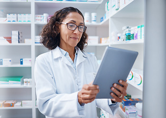 Image showing Senior woman, tablet and pharmacist in pharmacy for healthcare or stock check online in drugstore. Medication, telehealth technology and female medical doctor with touchscreen for research in shop.