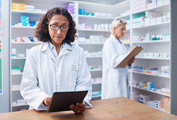 Image showing Senior woman, tablet and pharmacist in pharmacy for healthcare, telehealth or stock check. Medicine shop, technology and female medical doctor with touchscreen for research or online consultation.