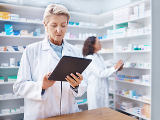 Image showing Tablet, senior woman and pharmacist in pharmacy for healthcare and stock check in shop. Medication research, telehealth technology and elderly female and medical doctor with touchscreen in drugstore.