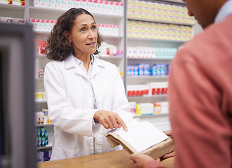 Image showing Pharmacy, medicine and senior woman pharmacist talking to man about pills side effects. Reading, prescription info and healthcare worker working with customer service for health and wellness check
