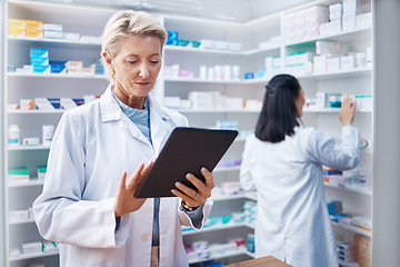 Image showing Tablet, senior woman and pharmacist in pharmacy order medication online in drugstore. Healthcare, telehealth technology or elderly female medical doctor with touchscreen for research in medicine shop