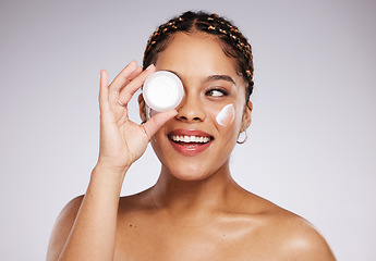 Image showing Skincare, health and woman with face cream in a studio for a beauty, natural and face routine. Cosmetic, wellness and female model with facial creme, spf or moisturizer treatment by a gray background
