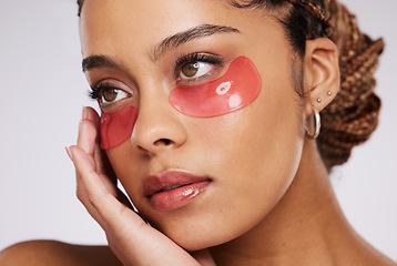 Image showing Eyes, beauty and mask on black woman for skincare, cosmetics and dermatology in studio. Face of aesthetic model person on a grey background with facial collagen gel patch for wellness glow on skin