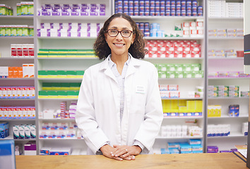 Image showing Pharmacy, pills and portrait of a woman pharmacist ready for customer service. Pharmaceutical store, medicine inventory and healthcare drug shelves with a happy employee feeling proud of dispensary