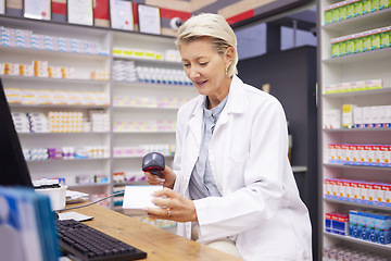 Image showing Pharmacy, smile and woman scanning medicine at checkout counter for prescription drugs. Healthcare, pills and certified senior pharmacist with medical product in box and digital scanner in drugstore.